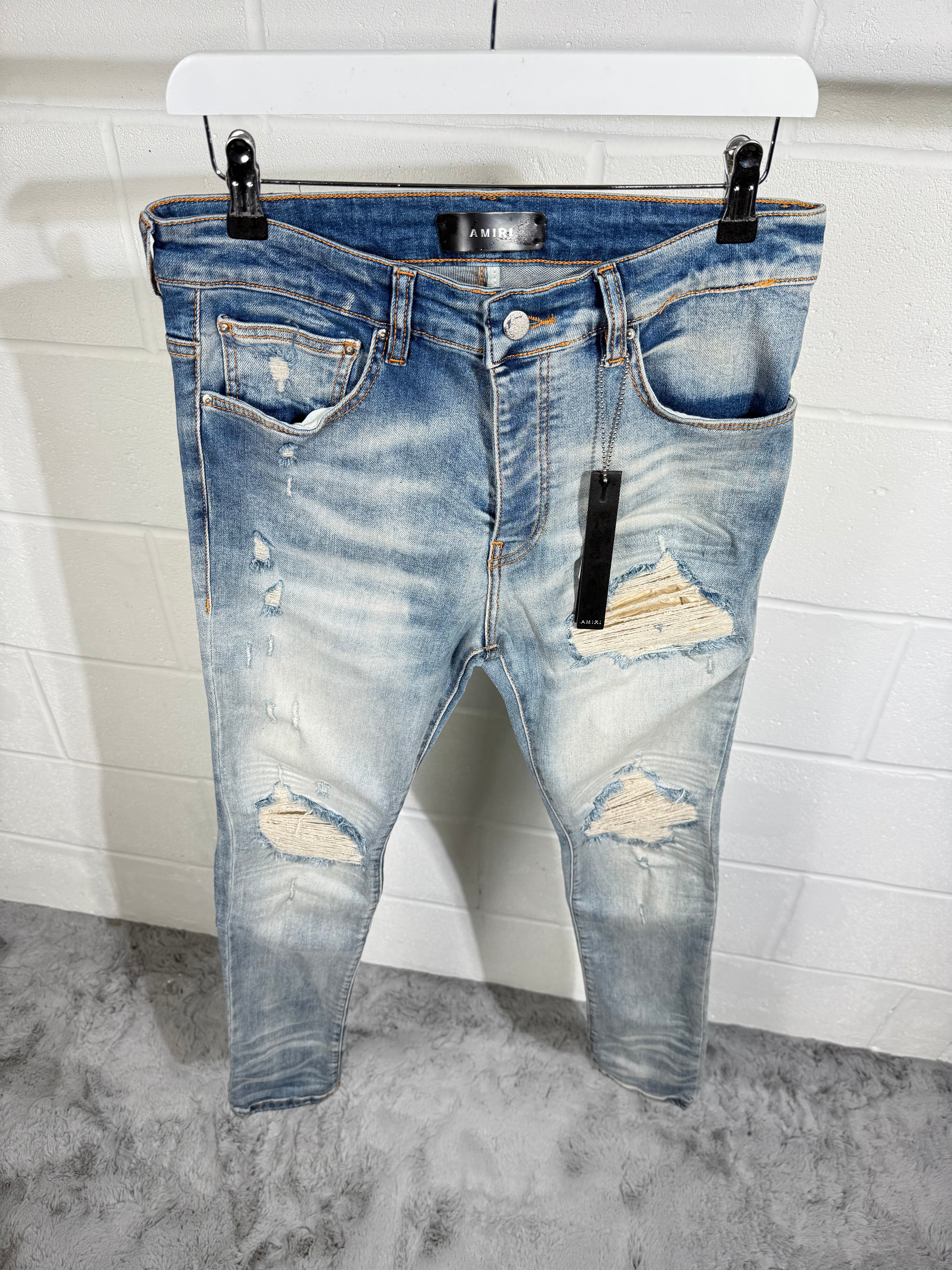 AMIRI RIPPED JEANS LIGHT BLUE